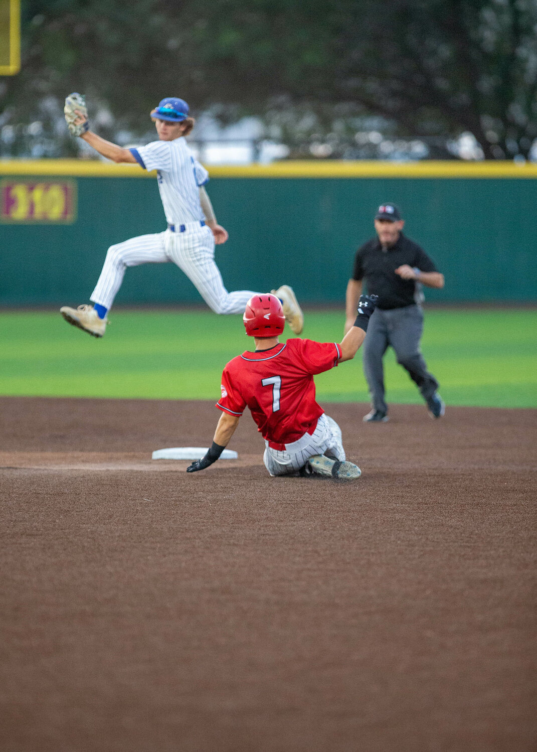 Brady Englett slides into second base during Wednesday's Regional Semifinal between Katy and Clear Springs at Deer Park.